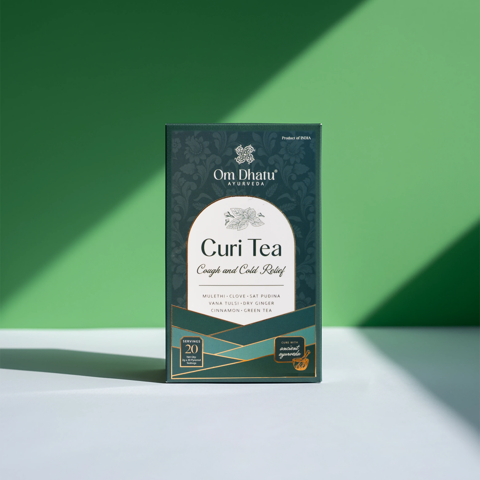 Steaming cup of Omdhatu Curi herbal tea next to the box, perfect for a cozy, health-conscious morning ritual