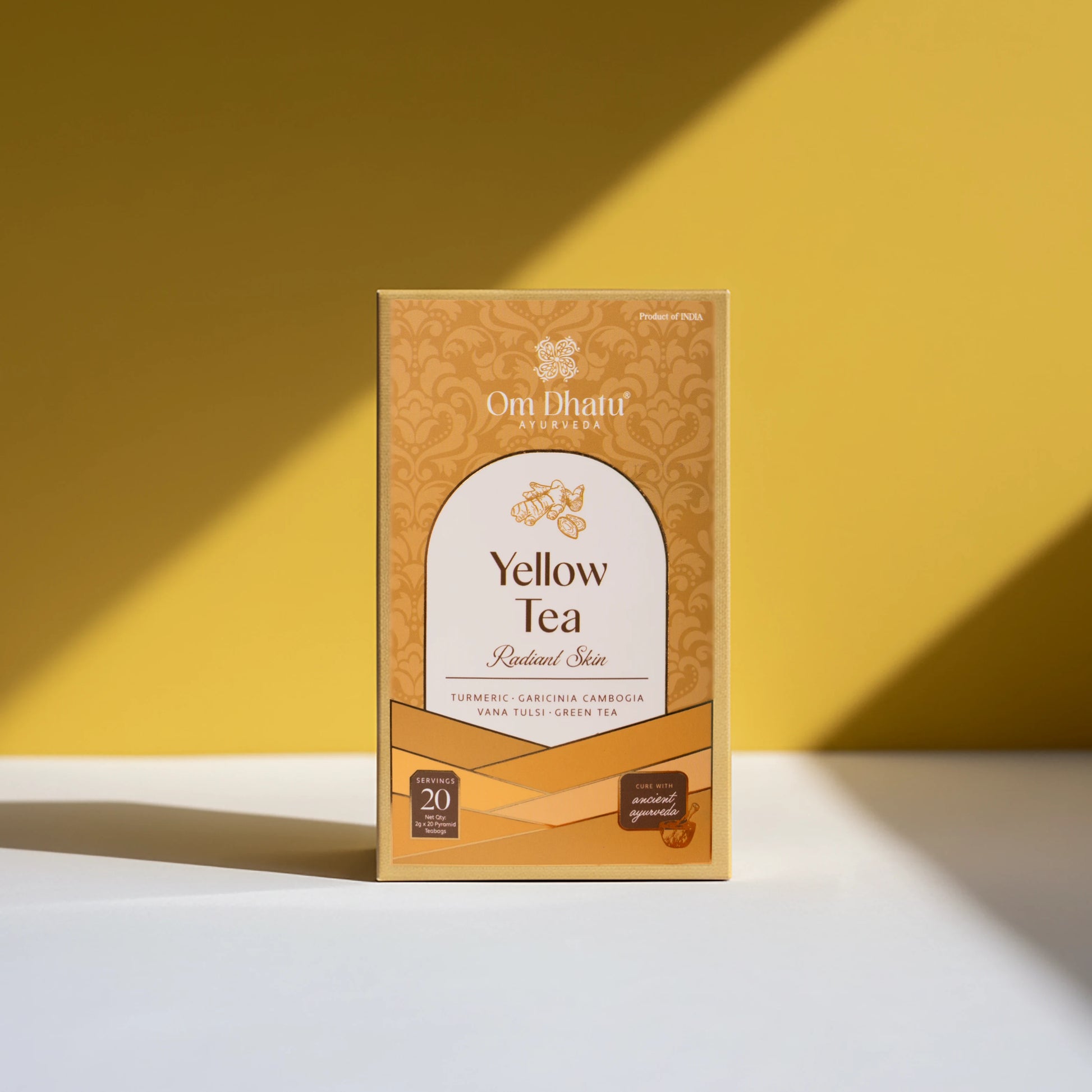 Box of Omdhatu Ayurvedic Yellow Tea bags, featuring bright, sun-kissed botanicals for energy and radiance